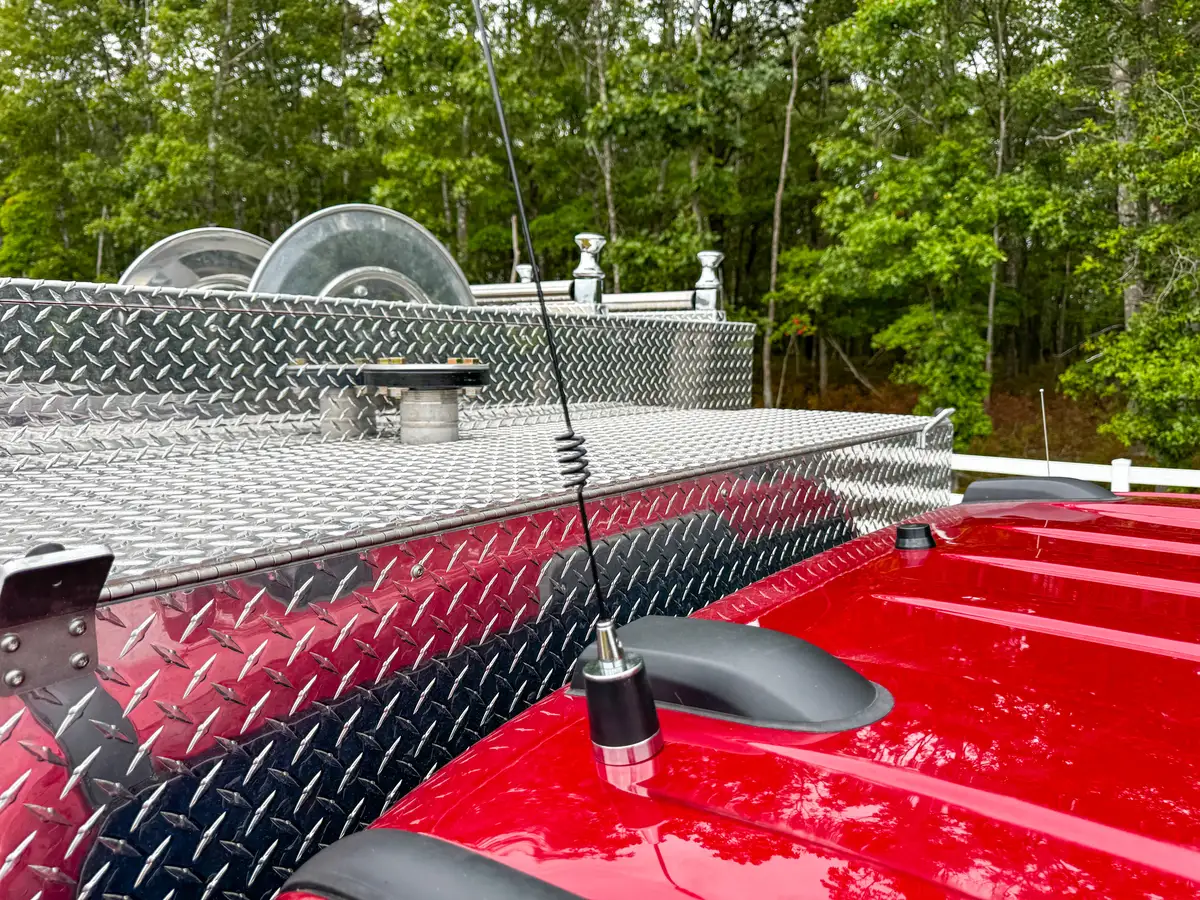 Right-side body profile view with compartments closed and rear wheel visible.